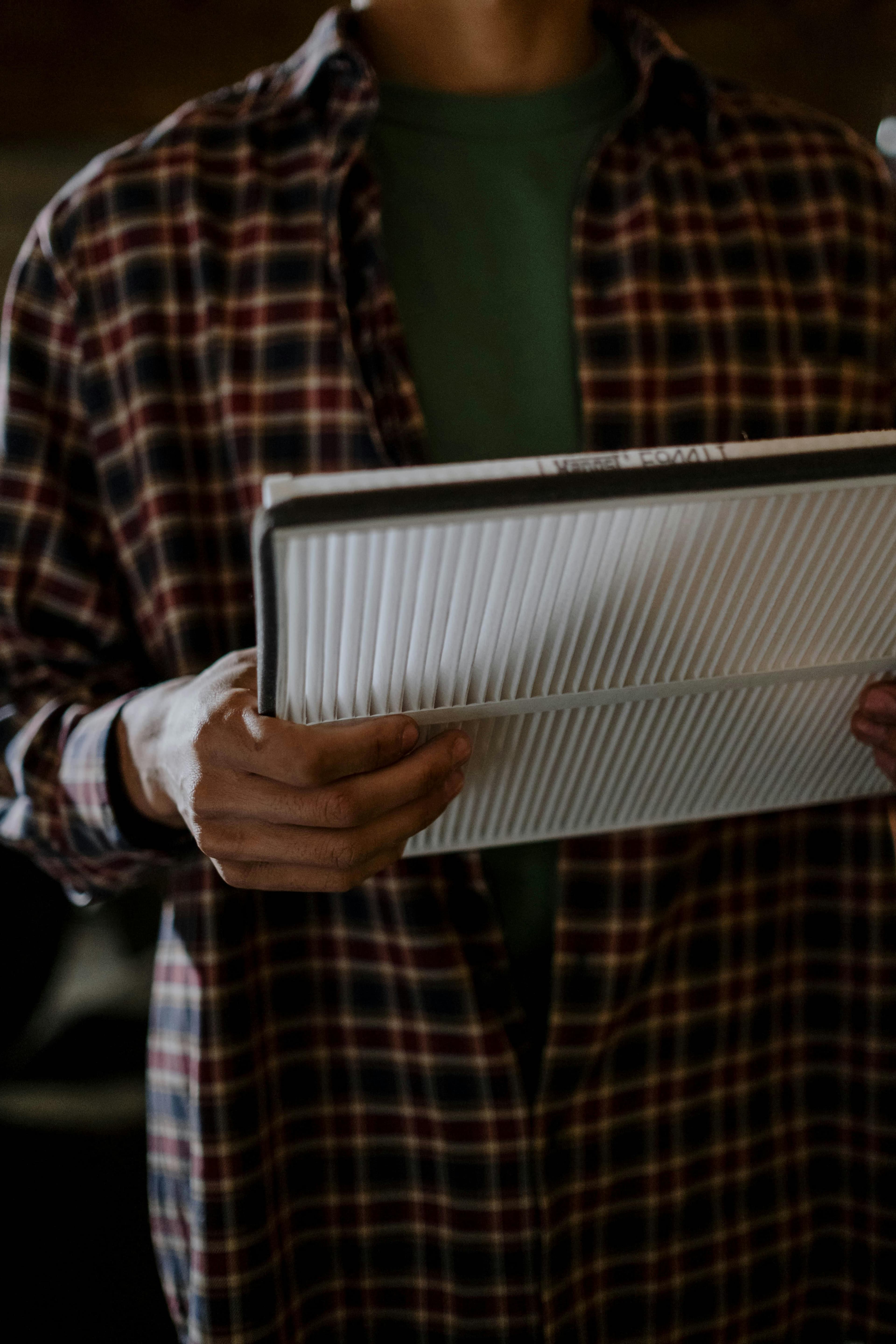 Replacing a furnace air filter in a utility closet