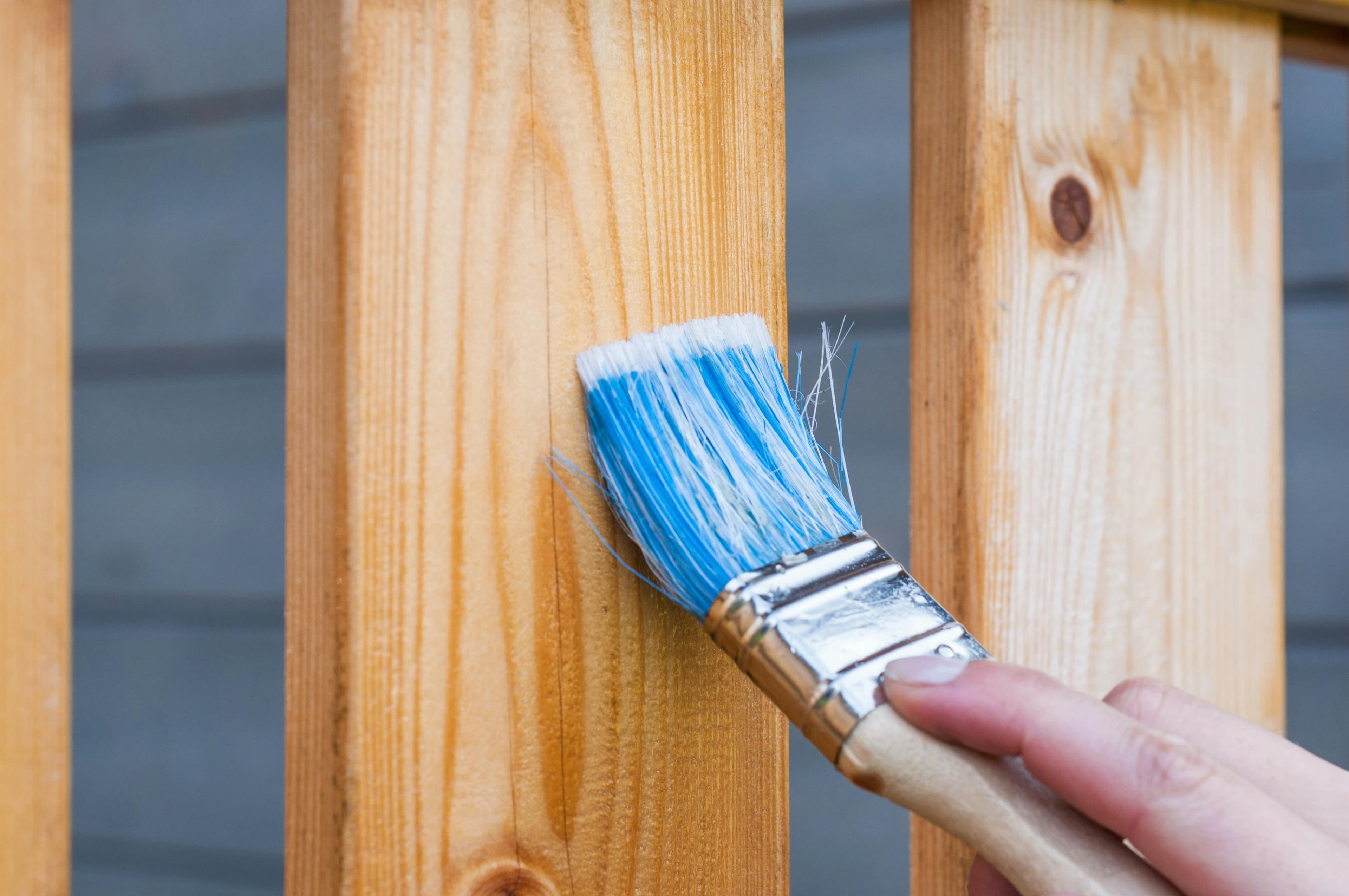 Handyman replacing a broken fence board in Rockland County backyard