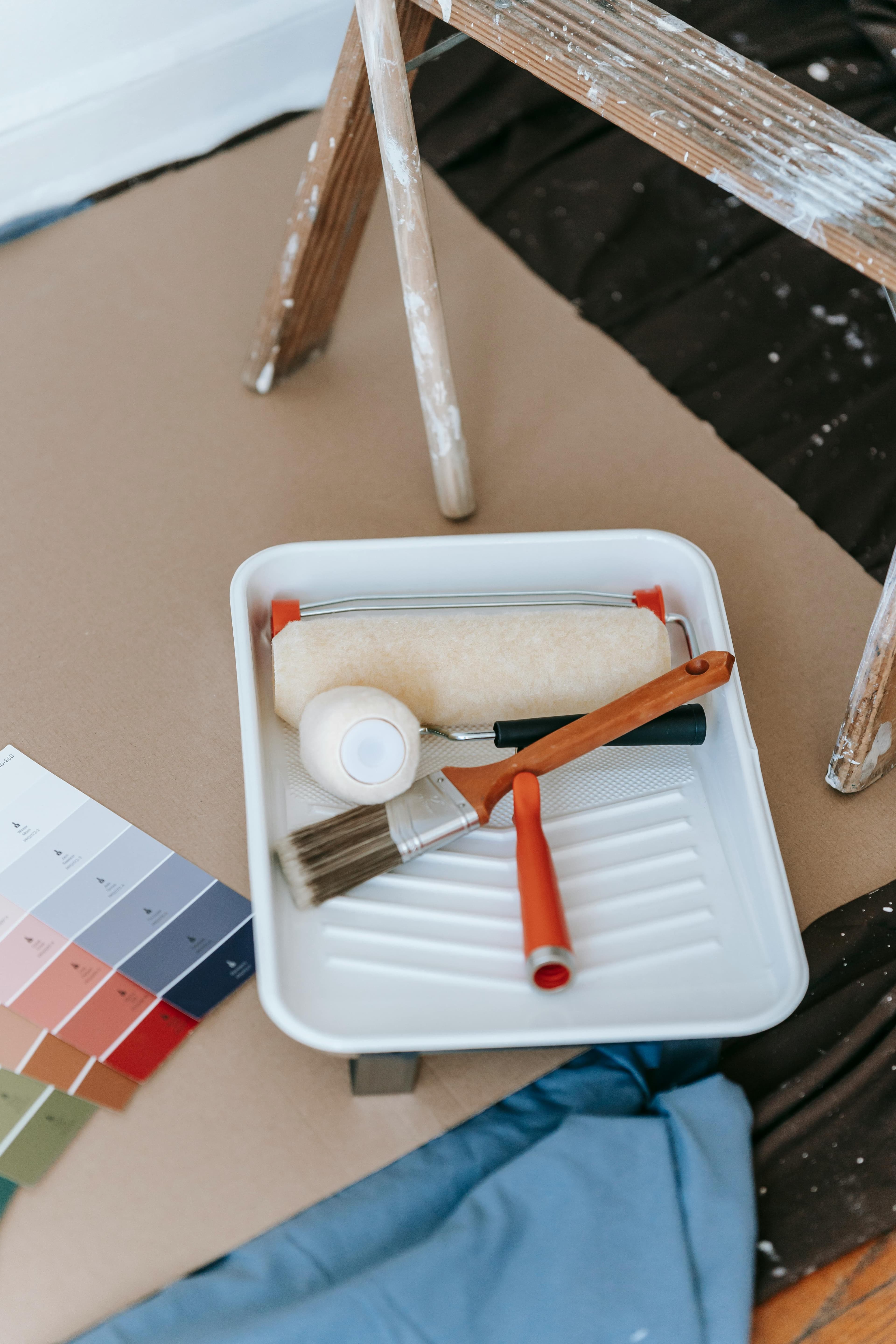 Odds & Ends painter applying second coat to accent wall