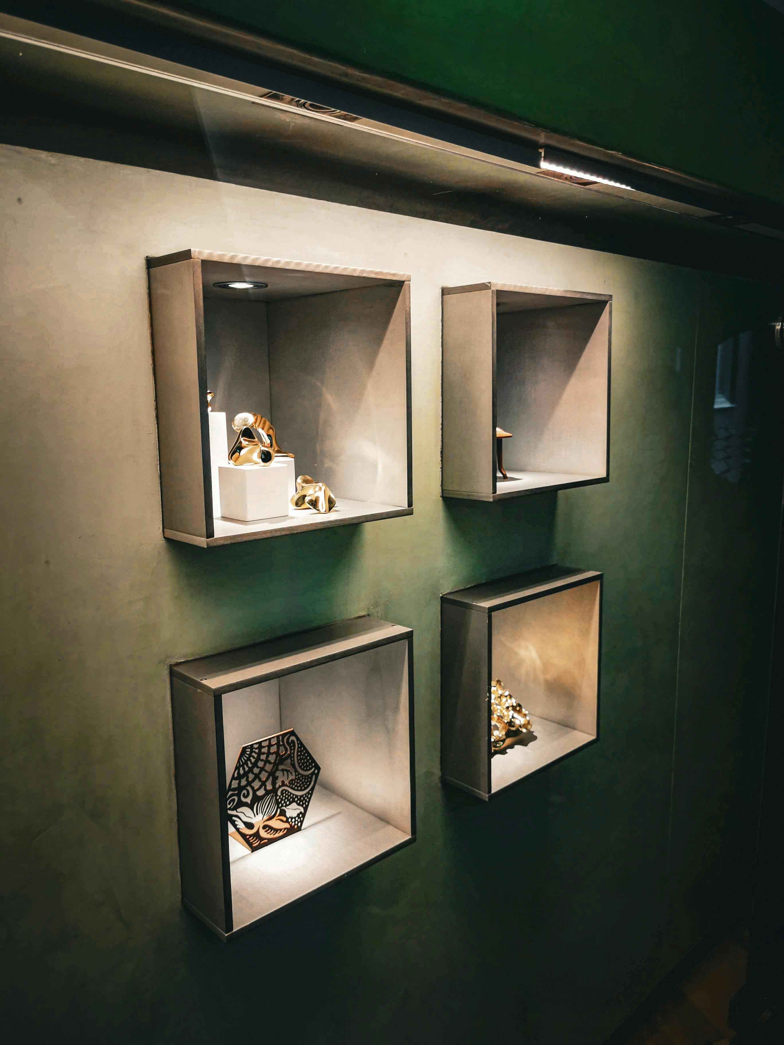 Odds & Ends installing floating shelves on living room wall